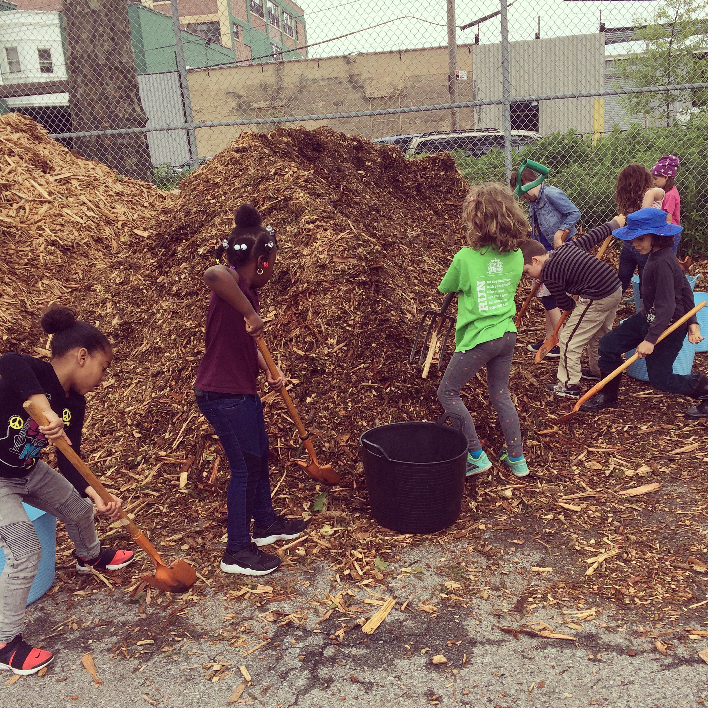  Never too young to shovel mulch 