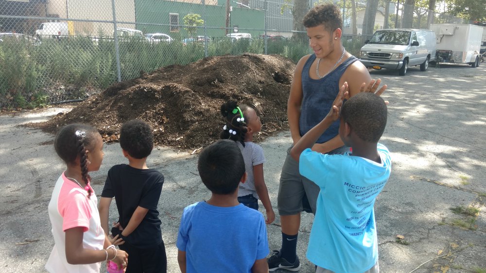  Juan leading a farm visit for campers from the Miccio in July! 